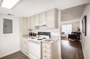 Hoover apartment for rent - A kitchen with white appliances and cabinets.