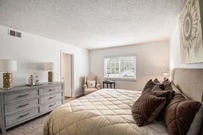 Hoover apartment for rent - A bedroom with a large bed and a window.
