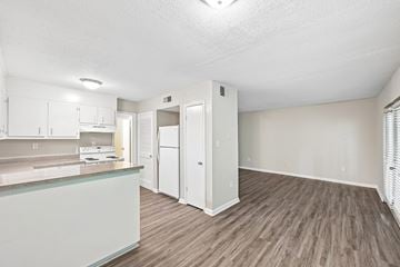 Hoover apartment for rent - A kitchen with white cabinets and a wooden floor.