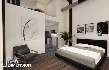 Birmingham apartment for rent - A bedroom with a bed, chair, and pictures on the wall.