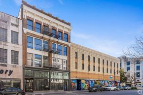Birmingham apartment for rent - A street view of a building with a mural on the side.