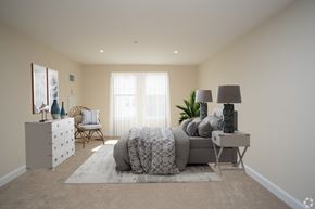 Arlington apartment for rent - a bedroom with a bed and a dresser