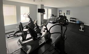 Arlington apartment for rent - a room filled with lots of exercise equipment