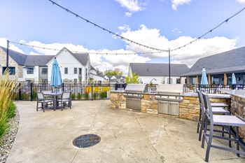 A patio with a table and chairs