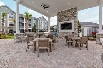 A patio with a table and chairs