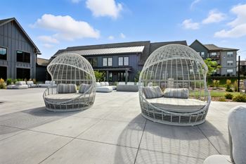 Two white outdoor chairs
