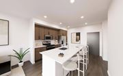 Fishers apartment for rent - A modern kitchen with a white table and chairs.