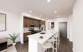 Fishers apartment for rent - A modern kitchen with a white table and chairs.