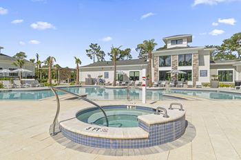A hot tub in the middle of a pool