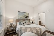Bradenton apartment for rent - A bedroom with a large bed and a painting on the wall at The Stadler Luxury Apartments, Florida