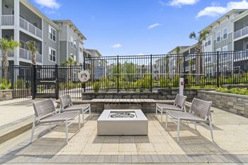 A patio with a fire pit