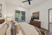 Sarasota apartment for rent - A bedroom with a large bed and a ceiling fan at The Concord Luxury Apartments, Sarasota, FL