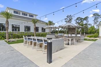 A patio area with a table set for dining