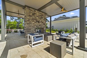 A patio with a stone pillar 
