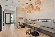 Sarasota apartment for rent - A modern dining area with a long table and chairs at The Concord Luxury Apartments, Sarasota, FL, 34240