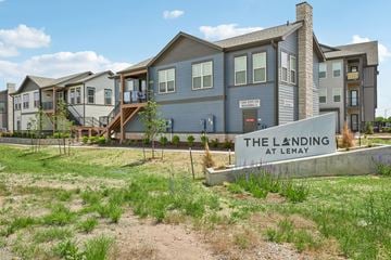 Fort Collins apartment for rent - A row of houses with a sign that says "The Landing at Lemay".