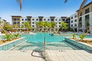 Sarasota apartment for rent - A swimming pool in front of apartment buildings at The Concord Luxury Apartments, Sarasota 34240