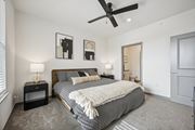 Fort Collins apartment for rent - a bedroom with a bed and a ceiling fan at The Quarry Luxury Apartment Homes, Colorado, 80526