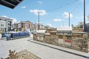 Fort Collins apartment for rent - Outdoor patio with a grill and a seating area at The Quarry Luxury Apartment Homes, Fort Collins