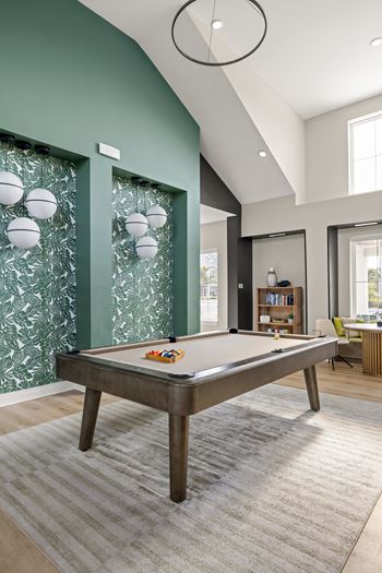 A game room with a pool table