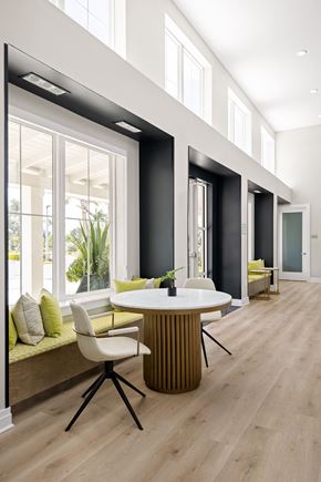 Ellenton apartment for rent - a dining room with a table and chairs in front of a large window at Palm Grove in Ellenton, FL 34222