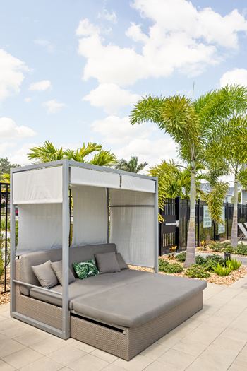 A patio with a couch and a canopy