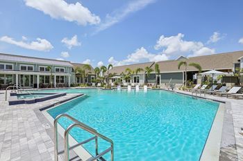 A large swimming pool with a metal railing.