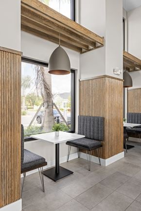 North Venice triplex for rent - a dining area with a table and chairs and a window at The Sophia, Venice, FL, 34275