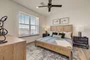 Monument apartment for rent - a bedroom with a bed and a ceiling fan at Alta25, Monument, Colorado