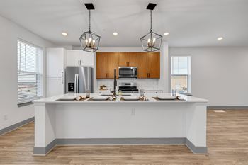 A kitchen with a large counter top and a sink