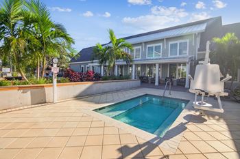 A swimming pool in front of a house