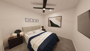 Monument apartment for rent - Modern bedroom with navy accent bedding and abstract artwork at The Maverick Luxury Apartments, Monument