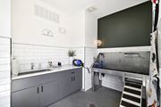 Raymore apartment for rent - a kitchen with stainless steel counters and a sink at The Depot in The Depot Raymore, MO 64083