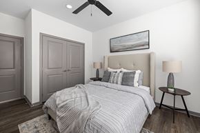 Lady Lake apartment for rent - A bedroom with a large bed and a ceiling fan at Standard441 Luxury Apartments, Lady Lake, Florida