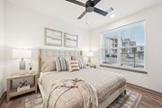 Fountain apartment for rent - a bedroom with a bed and a ceiling fan at The Garrison Luxury Apartment Homes, Colorado