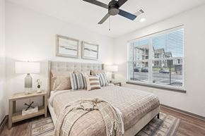 Fountain apartment for rent - a bedroom with a bed and a ceiling fan at The Garrison Luxury Apartment Homes, Colorado