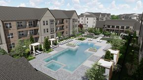 Longmont apartment for rent - A large swimming pool is surrounded by a patio and lounge chairs.