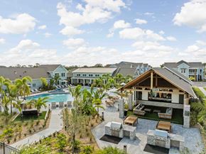 Rockledge apartment for rent - A large house with a pool and a patio area. at Junction Apartments in Rockledge, FL