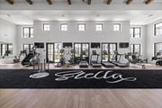 San Tan Valley apartment for rent - A gym with a black mat on the floor that says at Stella, San Tan Valley Arizona