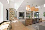Vero Beach apartment for rent - A modern kitchen with a pool table in the middle at Verity Luxury Apartments, Florida
