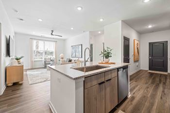 A modern kitchen with wooden cabinets and a large island