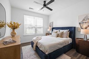 Vero Beach apartment for rent - A bedroom with a large bed and a ceiling fan at Verity Luxury Apartments, Vero Beach, 32960