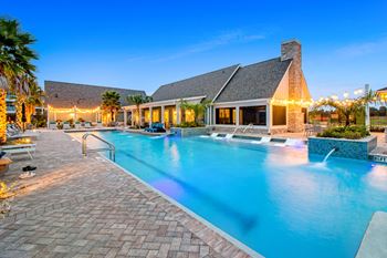 A pool outside of the clubhouse