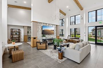 Longmont apartment for rent - A spacious living room with a fireplace and a large painting above it.