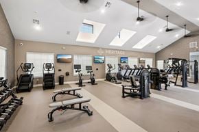 Longmont apartment for rent - A gym with a variety of equipment including treadmills, exercise bikes, and weight machines.
