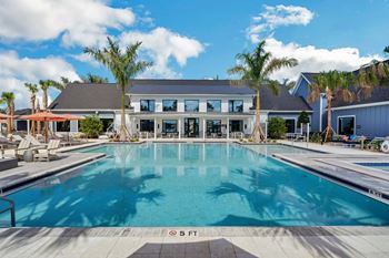 A large swimming pool in front of a building