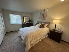 Pittsburgh apartment for rent - a bedroom with a bed and two night standsat Holiday Park Apartments, Pennsylvania