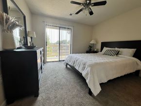 Monroeville apartment for rent - a bedroom with a large bed and a ceiling fan at Belmont Ridge Apartments, Monroeville, PA, 15146