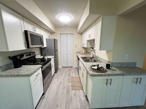 Monroeville apartment for rent - Kitchen with white cabinets and stainless steel appliances at Belmont Ridge Apartments, Monroeville, PA, 15146