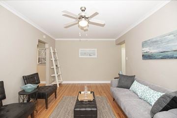 Winnipeg apartment for rent - a living room with a couch and a ceiling fan